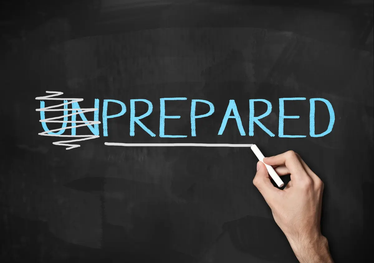 The word unprepared being transformed into prepared on a chalkboard