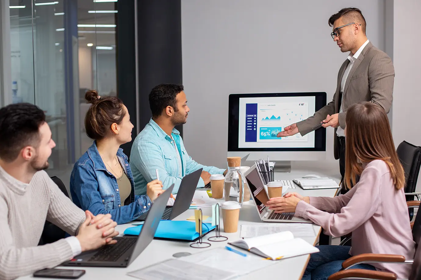 A team reviewing workforce information during a meeting
